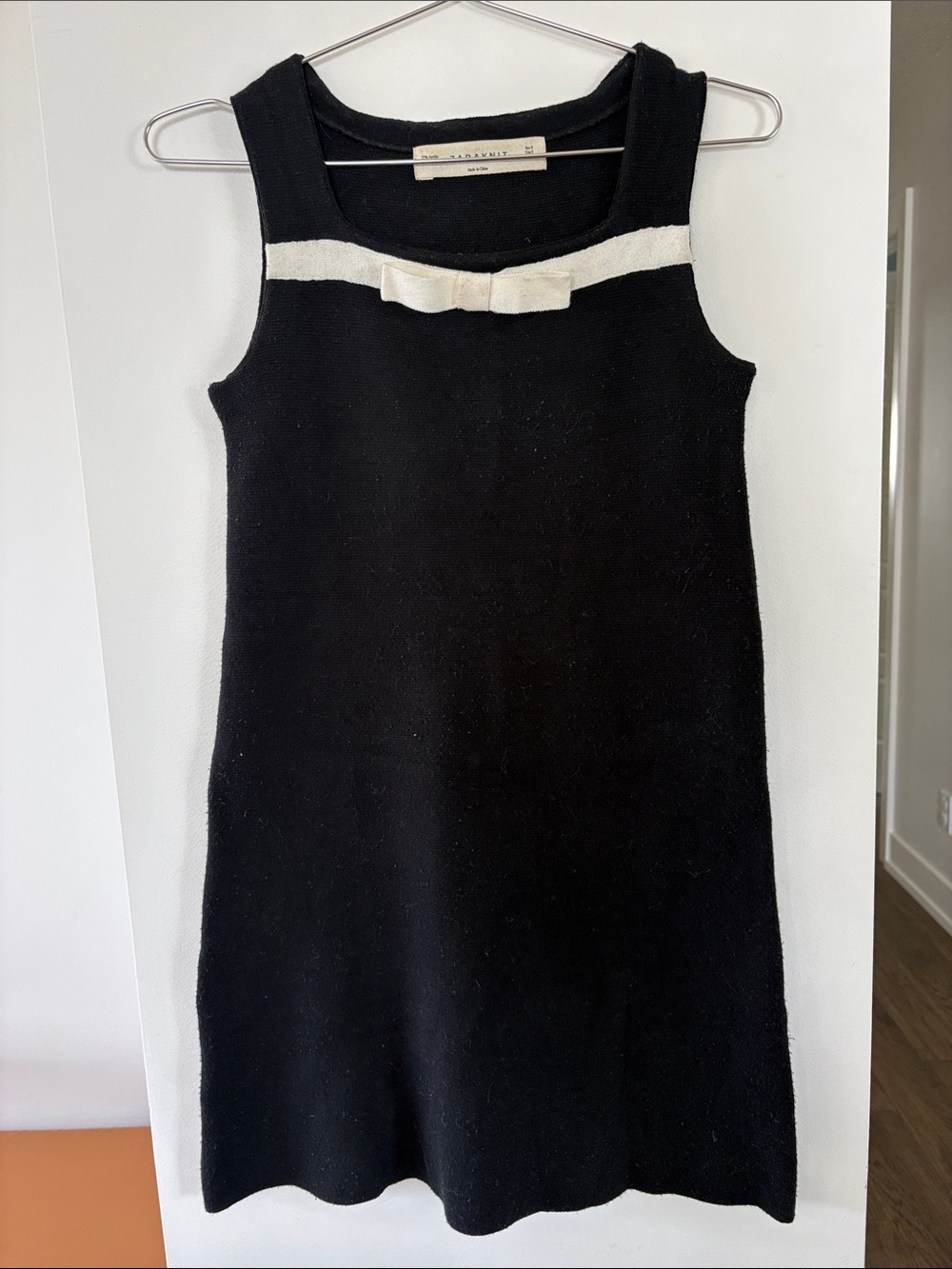 Classic Black Sleeveless Dress with Ivory Bow